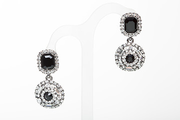 Image showing earrings with black stones on the white