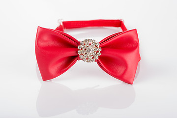 Image showing red bow tie with sequins on a white background