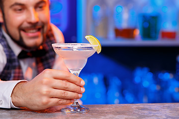 Image showing Barman at work, preparing cocktails.