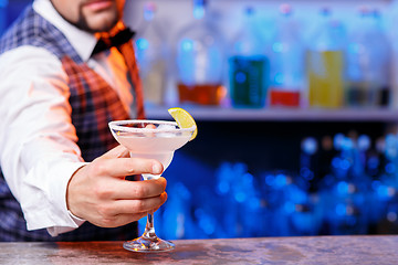 Image showing Barman at work, preparing cocktails.