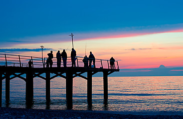 Image showing Fishermen on a dock