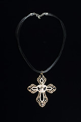Image showing necklace with cross isolated on black background
