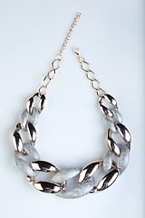Image showing plastic necklace. gold, Platinum