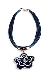 Image showing necklace. black flower