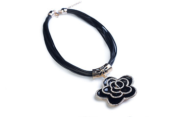 Image showing necklace. black flower