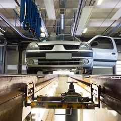 Image showing Car on service platform in garage.