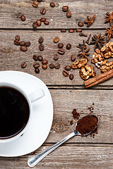 Image showing The cup of coffee on wooden table