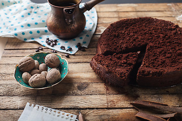 Image showing Chocolate cake, coffee and cinnamon sticks