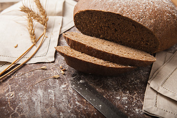 Image showing Bread rye spikelets on an wooden background