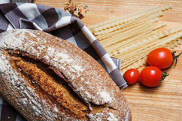 Image showing The bread on an wooden background