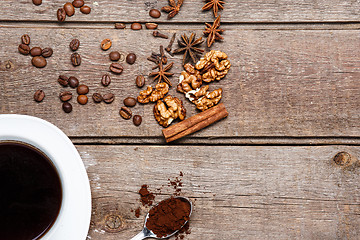 Image showing The cup of coffee on wooden table