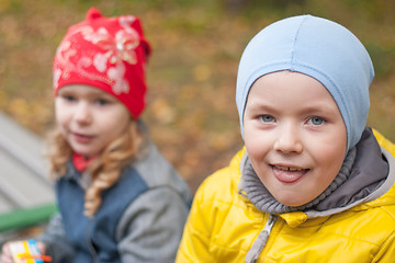 Image showing two children in a park in autumn, portrait