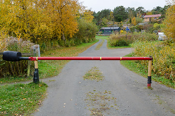 Image showing one small road with a road barriier