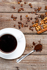 Image showing The cup of coffee on wooden table