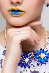 Image showing Fashion Yellow, Blue Sexy Lips and Closeup. Make up concept. 