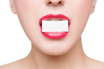 Image showing girl holds in teeth white form. isolated