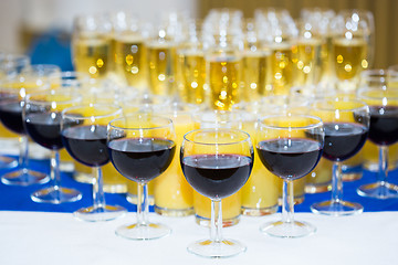 Image showing Glasses with champagne on the party table. lot of alcohol