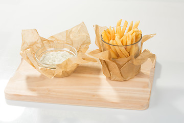 Image showing Fried potato chips in the glass 