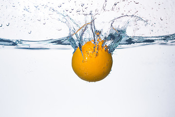 Image showing orange splash in water 