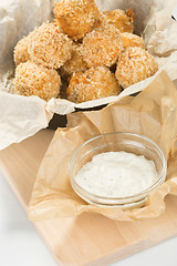 Image showing Breaded potato balls with sauce