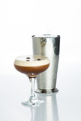 Image showing Layered Chocolate Cocktail with Whipped Cream in Glass Isolated White Background