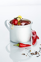 Image showing bloody mary cocktail in the iron circle on a white background