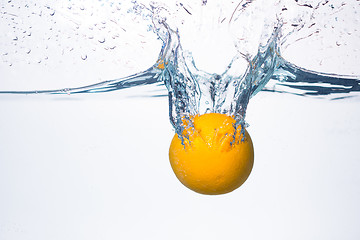 Image showing orange splash in water 