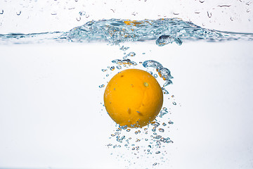 Image showing orange splash in water 