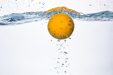 Image showing orange splash in water 