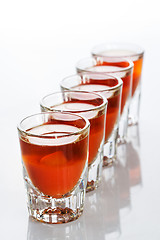 Image showing Beautiful shot glasses back lit. red