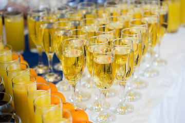 Image showing Glasses with champagne on the party table. lot of alcohol