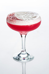 Image showing Pink cocktail decorated with marshmallow isolated on white background