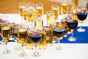 Image showing Glasses with champagne on the party table. lot of alcohol