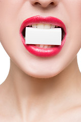 Image showing girl holds in teeth white form. isolated