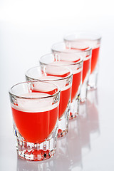 Image showing Beautiful shot glasses back lit. red