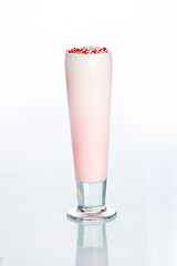 Image showing Pink cocktail decorated with marshmallow isolated on white background