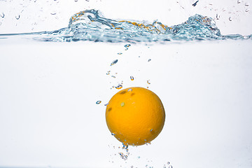 Image showing orange splash in water 