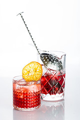 Image showing Amber cocktail in a glass isolated on white background