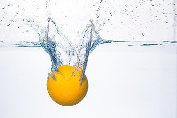 Image showing orange splash in water 