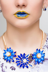 Image showing Fashion Yellow, Blue Sexy Lips and Closeup. Make up concept. 