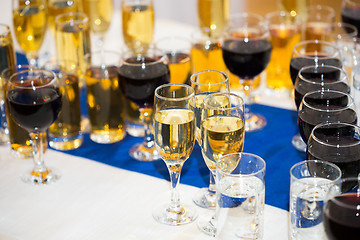 Image showing Glasses with champagne on the party table. lot of alcohol