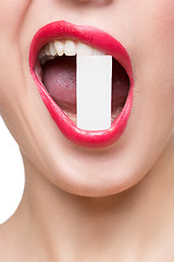 Image showing girl holds in teeth white form. isolated
