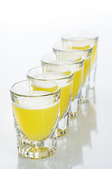 Image showing Beautiful shot glasses back lit. yellow