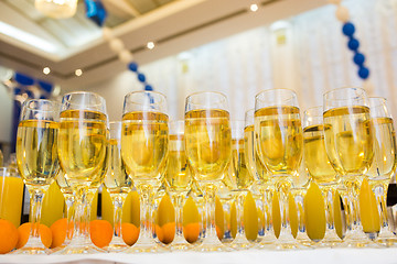 Image showing Glasses with champagne on the party table. lot of alcohol