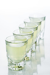 Image showing Beautiful shot glasses back lit. yellow