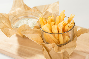 Image showing Fried potato chips in the glass 