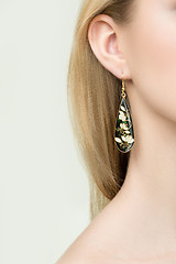 Image showing close up of woman wearing shiny diamond earrings