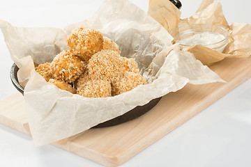 Image showing Breaded potato balls with sauce