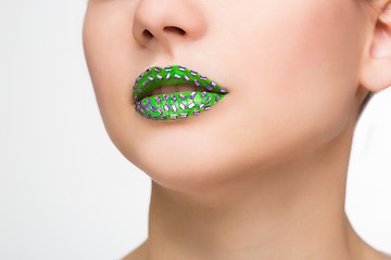 Image showing Fashion Green Sexy Lips and Closeup. Make up concept. 