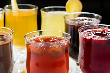 Image showing mulled wine. fruit or berry drink. alcohol winter. against a dark background